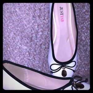 White with black trim flats. Size 6.